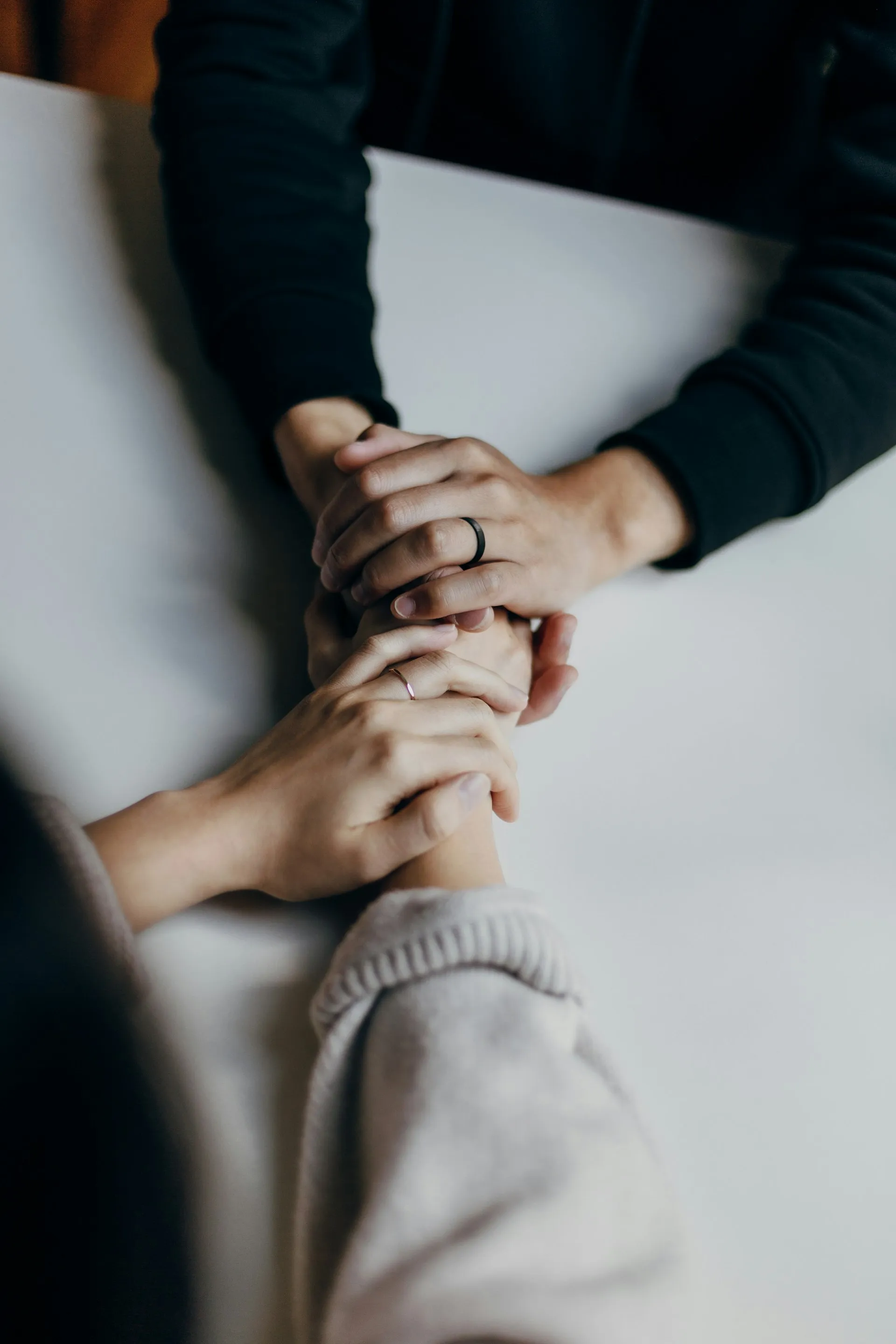 Hands holding gently